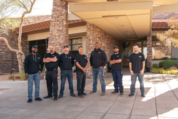 Seven Summit Fire and Security employees posing outside