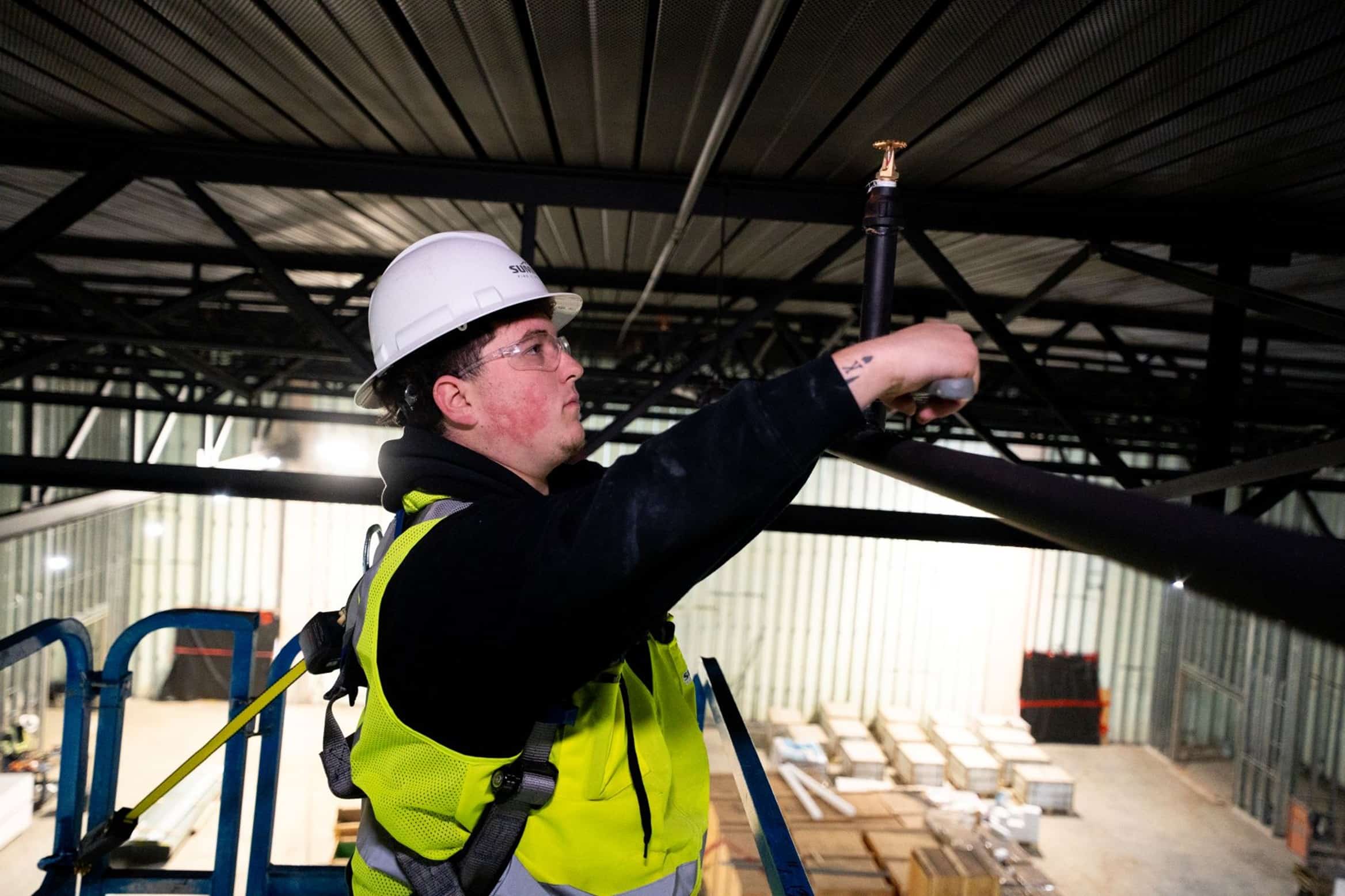 Technician working on an industrial sprinkler