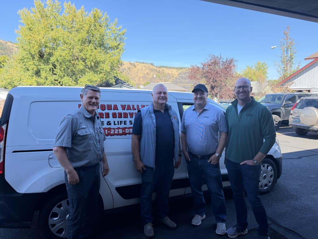 Umpqua Valley owners with Summit Fire & Security representatives